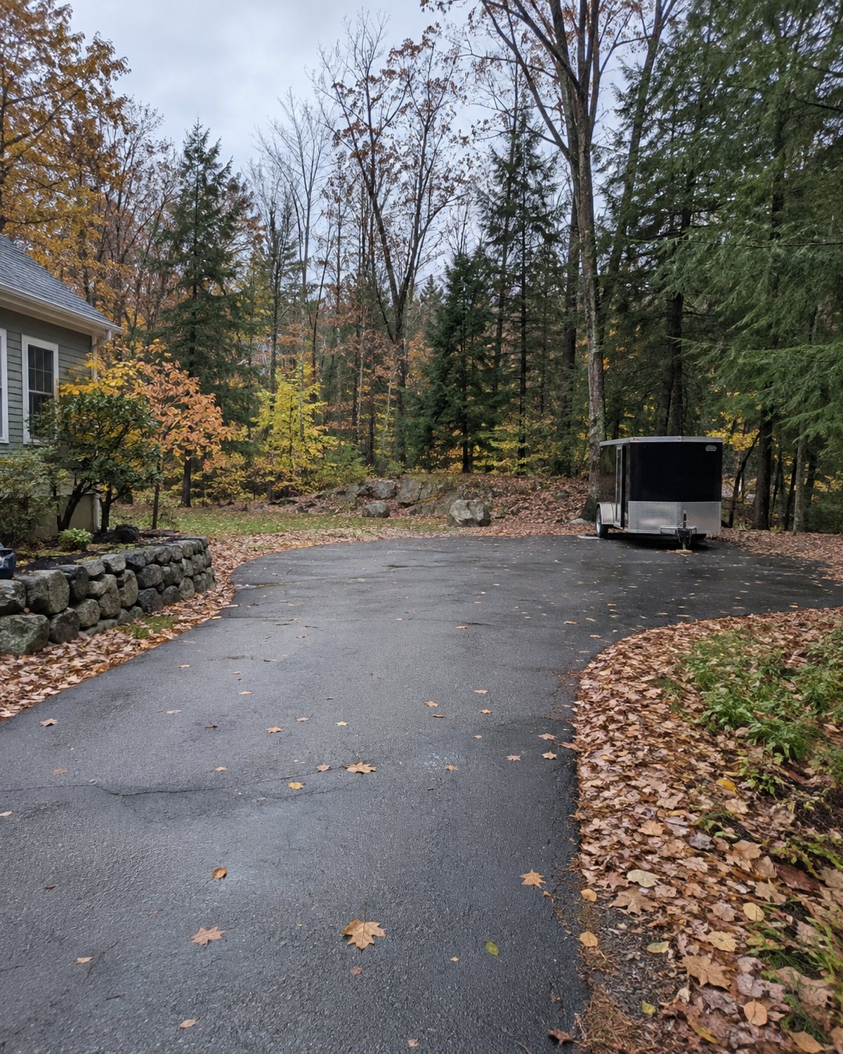 Lebanon property with driveway, mature trees, and space for seasonal service access